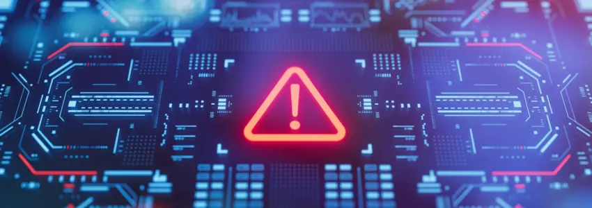 Warning icon on a digital LCD display with reflection. Concept of cyber attack, malware, ransomware, data breach, system hacking, virus, spyware, compromised information and urgent attention.
